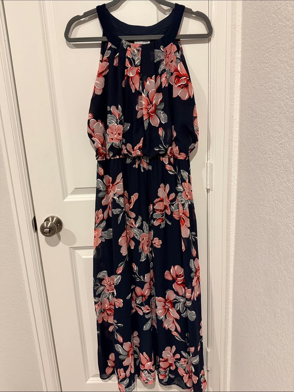 Show off that summer tan in a Navy Floral Halter Maxi Dress with Pink Blooms